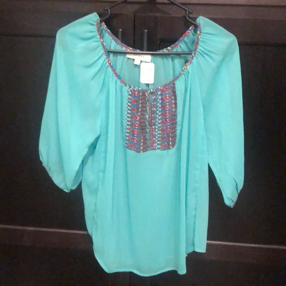 UMGEE shirt. Brand New ! Never worn. SMALL.